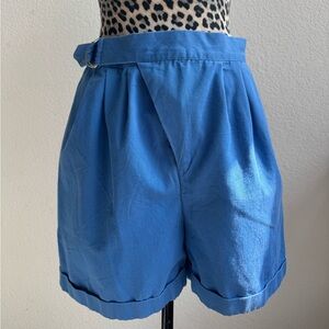 Vintage high-waisted blue shorts with belt.